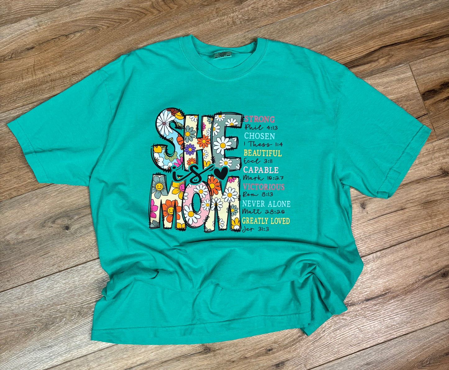 She Is Strong Christian Graphic Tee – Faith Inspirational Floral Shirt