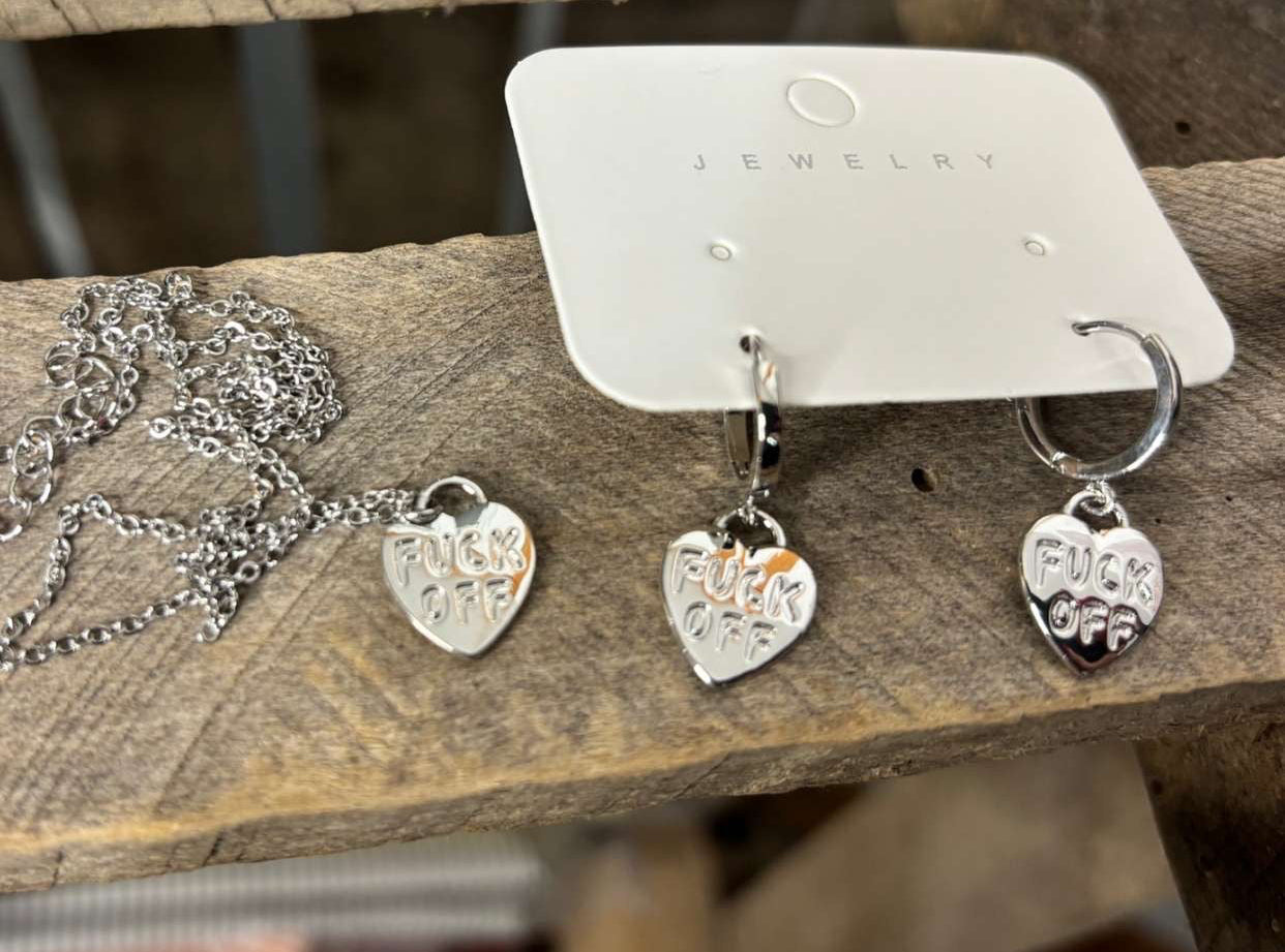 Silver heart-shaped earrings on a wooden surface with 'MATCHING SET' text.