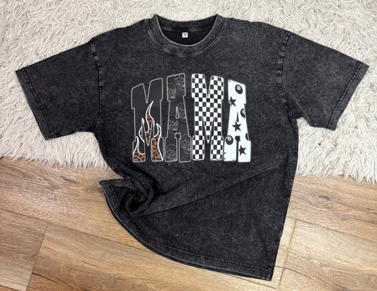 Black t-shirt with graphic design on a wooden floor