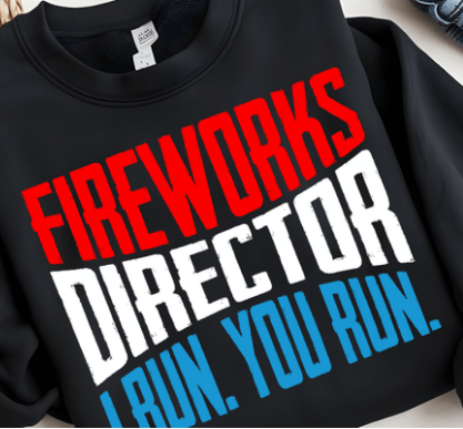 Black sweatshirt with colorful text 'Fireworks Director I Run. You Run.' on a light background