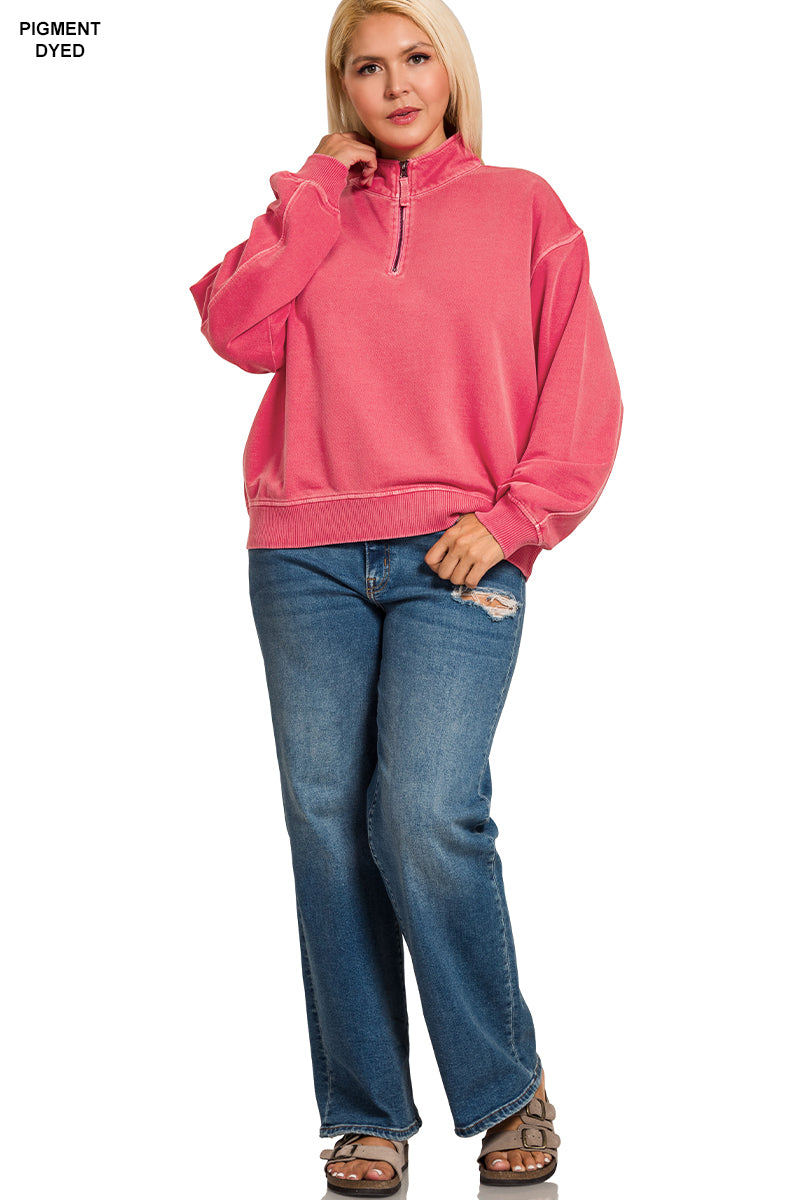 Woman wearing a pink pullover and blue jeans on a white background