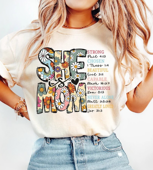 She Is Strong Christian Graphic Tee – Faith Inspirational Floral Shirt
