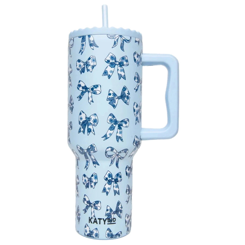 Light blue tumbler with blue bow pattern and 'KATYDID' branding on a white background