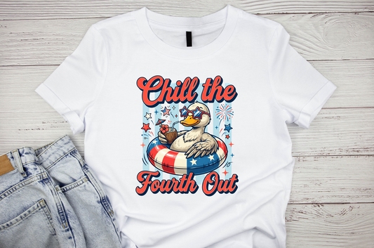 White t-shirt with a graphic of a duck and text 'Chill the Fourth Out' on a wooden surface.