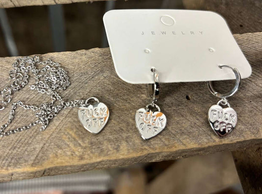 Silver heart-shaped earrings on a wooden surface with 'MATCHING SET' text.